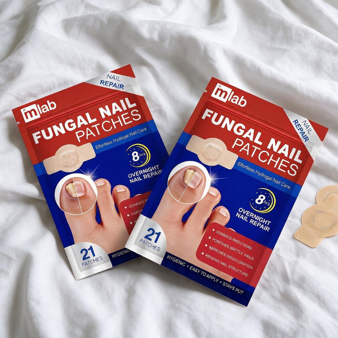 Two packages of mlab Fungal Nail Patches arranged on a white fabric background, with a few beige patches placed to the right.